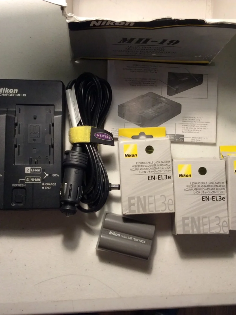 Nikon Battery Charger and 3 Nikon Batteries
